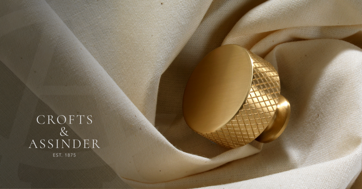 Crofts & Assinder, Est. 1875 - a gold cabinet handle